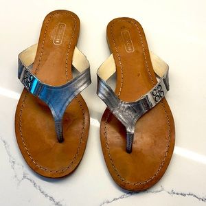 Silver coach slides. Size 6. In good used condition.
